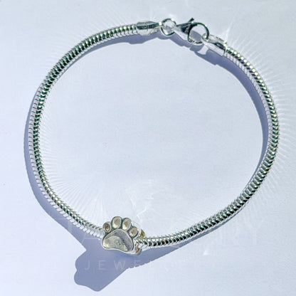 Pawprint memorial charm and bracelet in sterling silver for ash, hair and fur inclusions. 