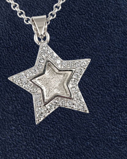A sterling silver star pendant surrounded with cubic zirconias. 