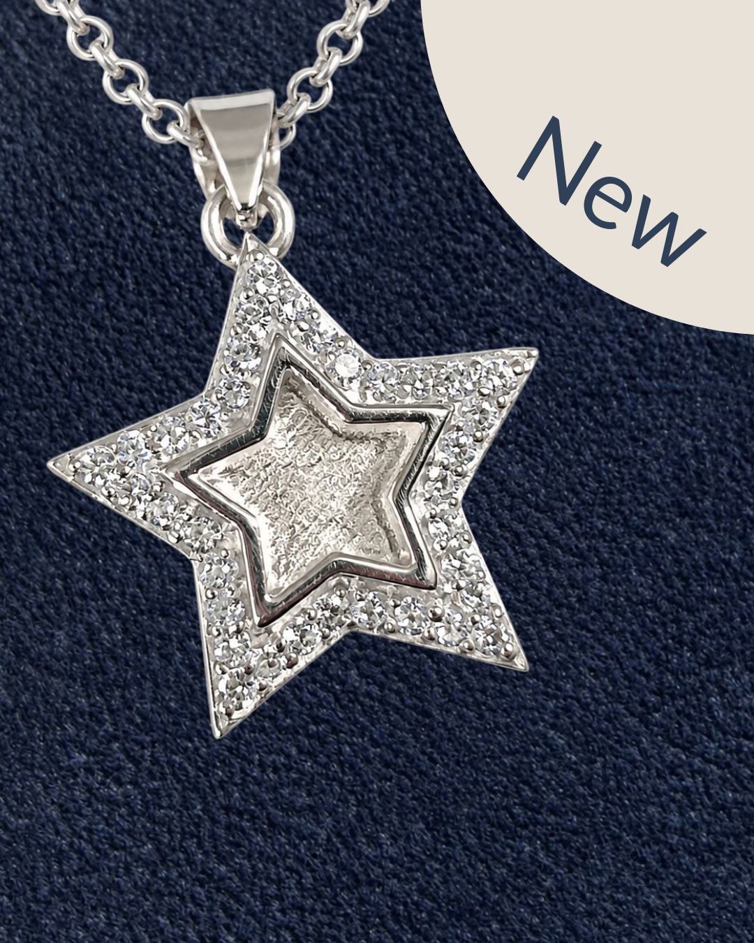 A sterling silver star pendant surrounded with cubic zirconias. 